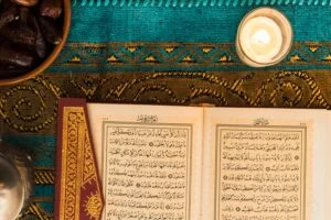 close up candle near quran 23 2147868945 1 تحفيظ القرآن الكريم وتعليم التلاوة والتجويد عن بعد